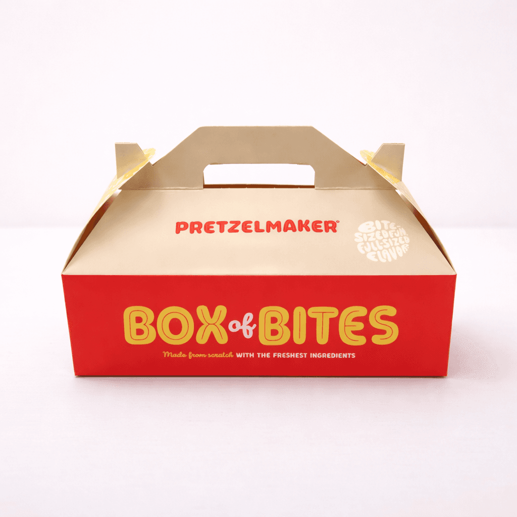 Red and tan gable box with built-in handle showing bakery branding