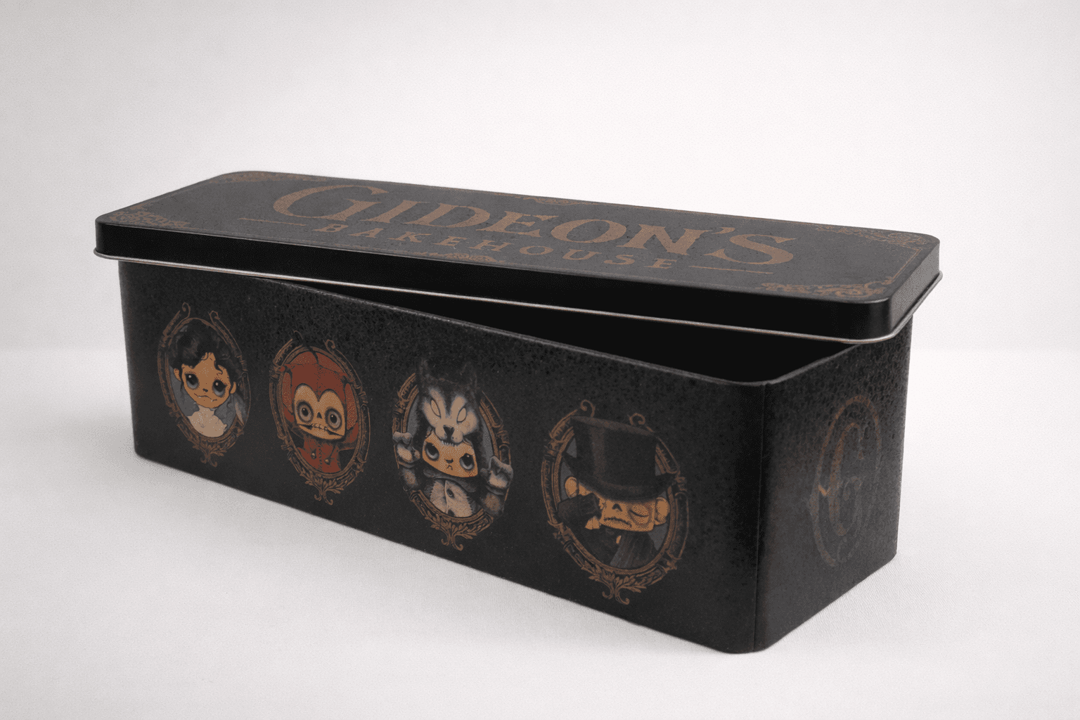 Black rectangular cookie tin with vintage-style character artwork